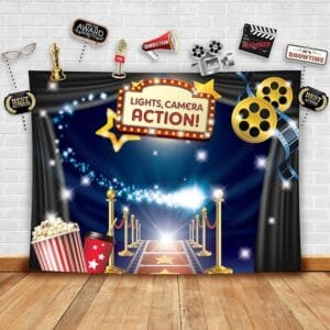 Hollywood red carpet themed photo booth backdrop with movie props