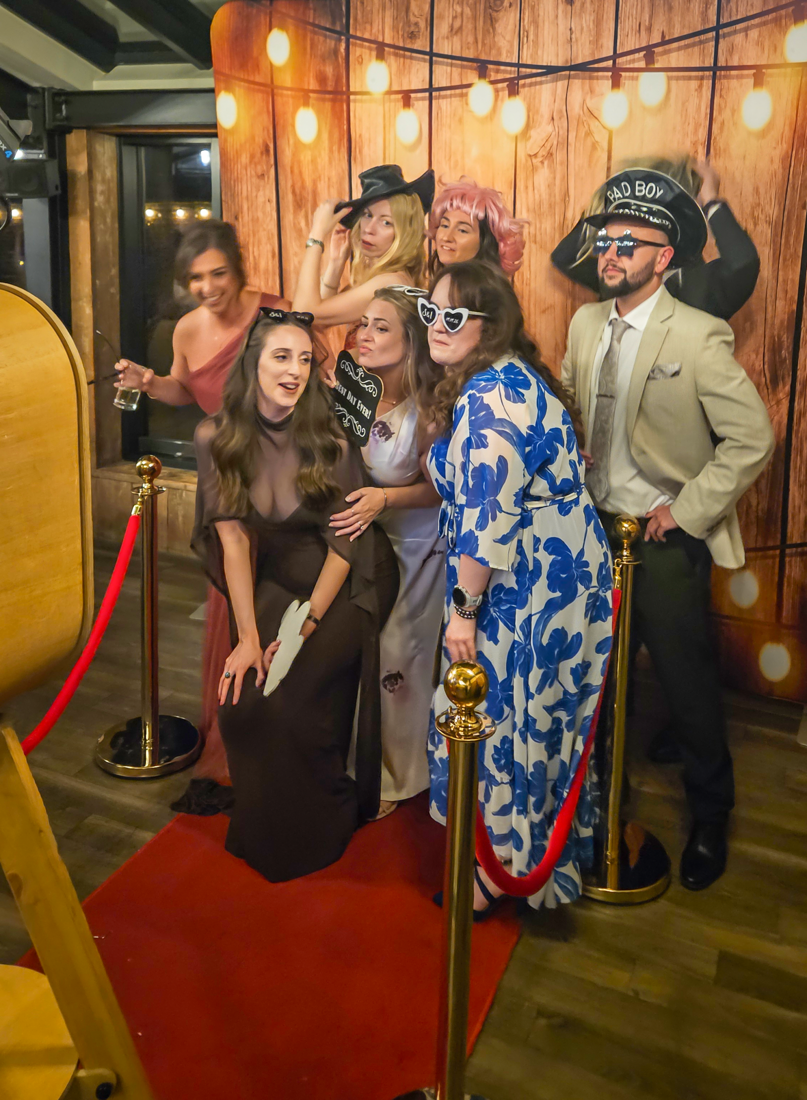 Wards photo booth hire Wolverhampton guests posing with props on VIP red carpet at wedding reception
