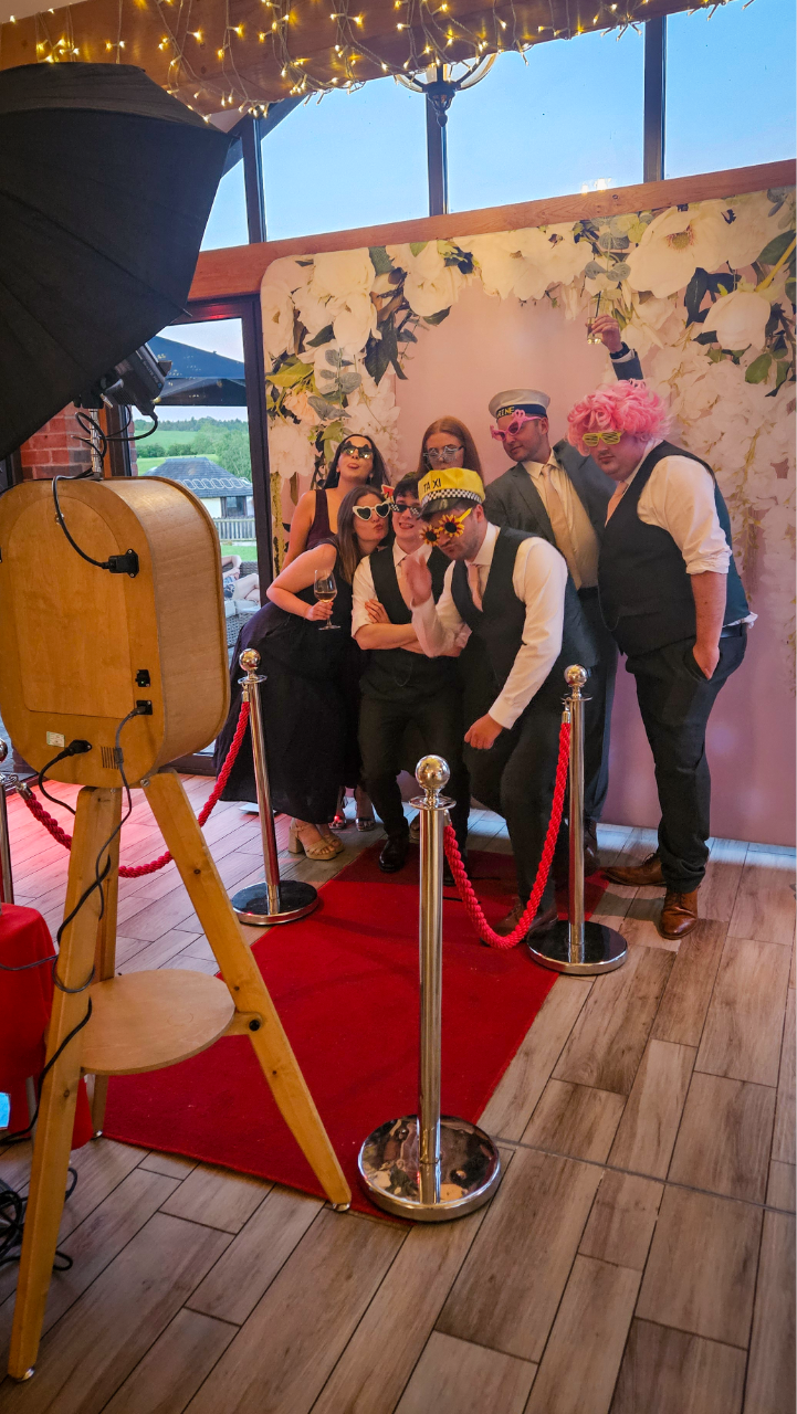 Retro wooden pod luxury wedding photo booth hire Wolverhampton with floral backdrop